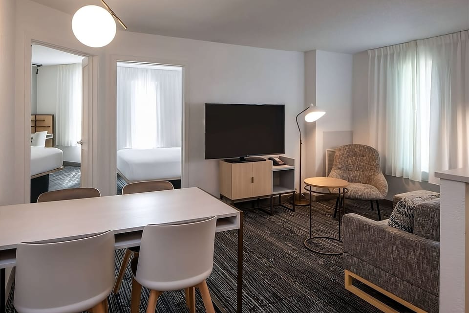 Gather for meals and movies in this airy lounge space
