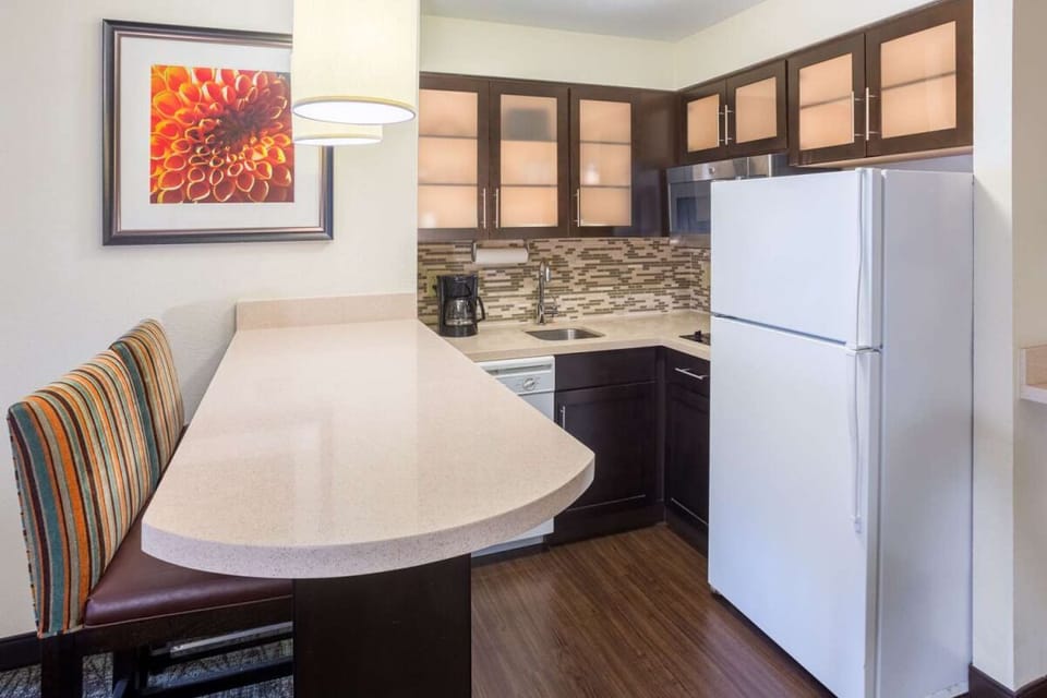 Gather for easy meals at the bar beside the kitchenette.