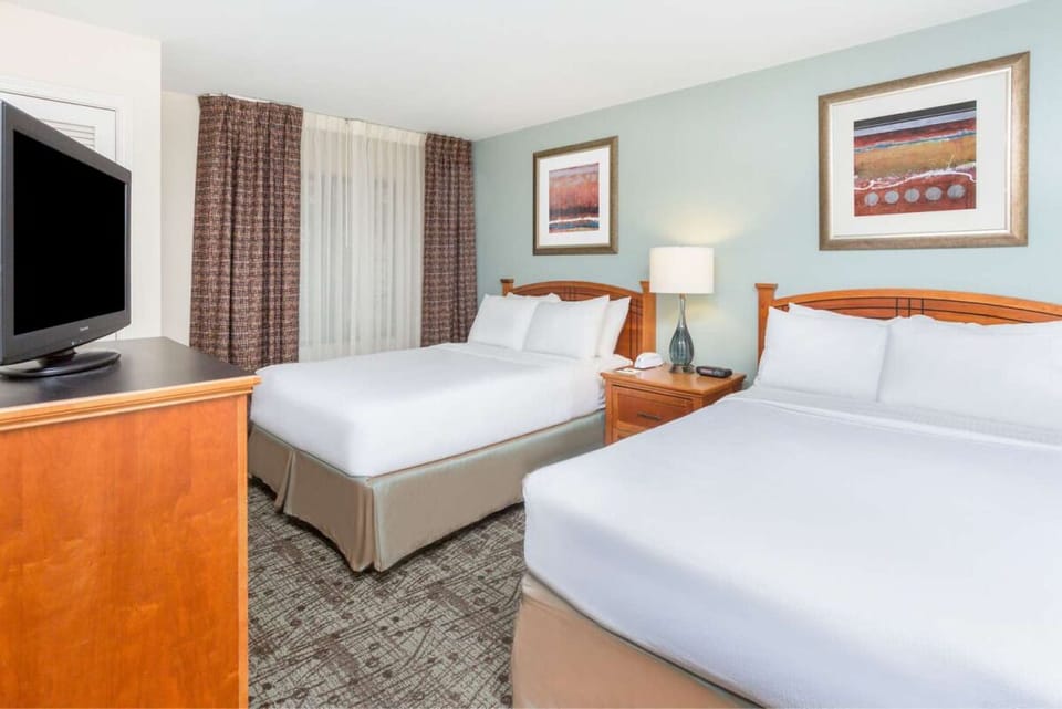 Stretch out with two cozy beds and calming, airy decor.
