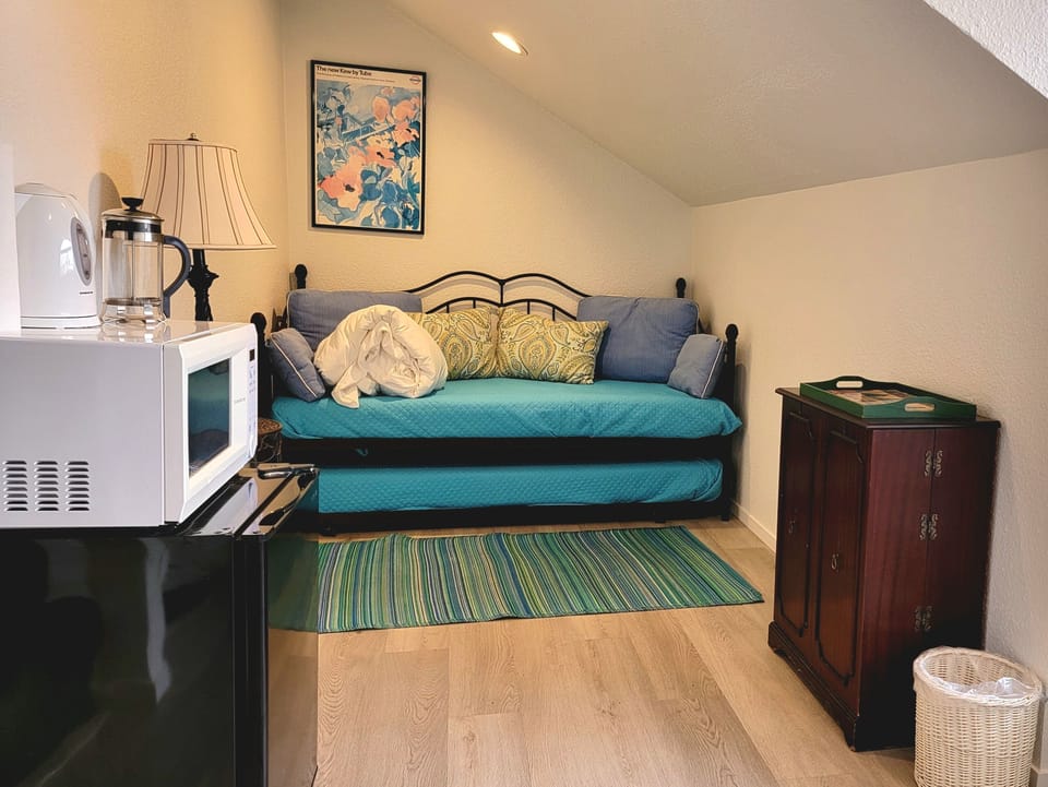 No kitchen/utensils. We provide microwave, electric kettle, 4 mugs, & coffee.