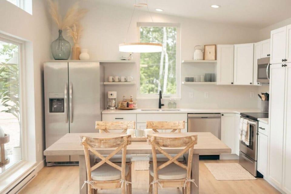 Fully stocked kitchen and a table big enough to puzzle on