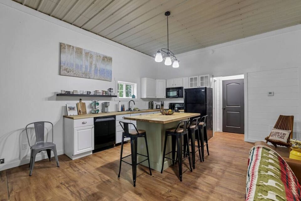 Kitchen and island with bar stools