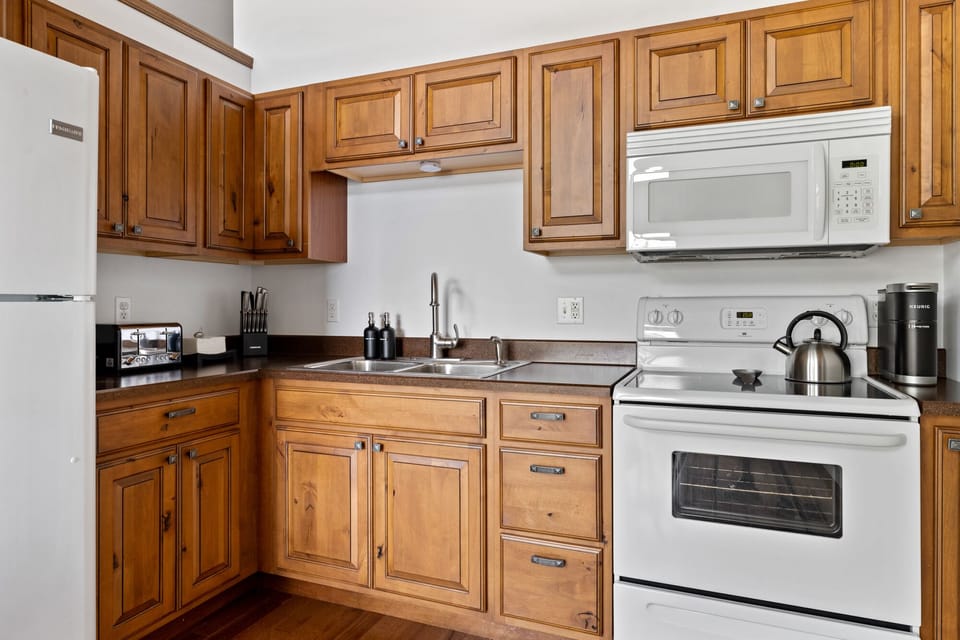 The kitchen is stocked with a deluxe housewares package.