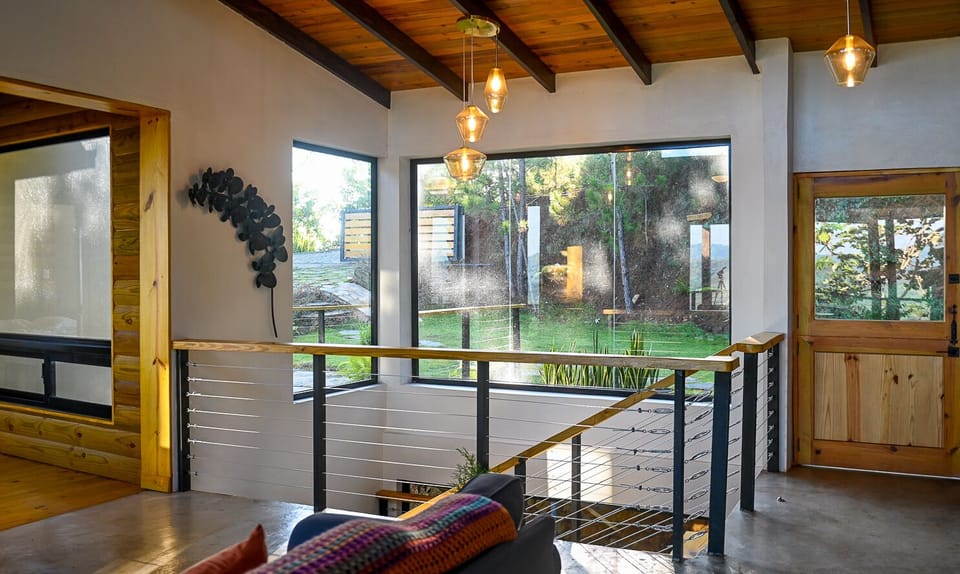 The home is full of large windows allowing the outdoors in. 