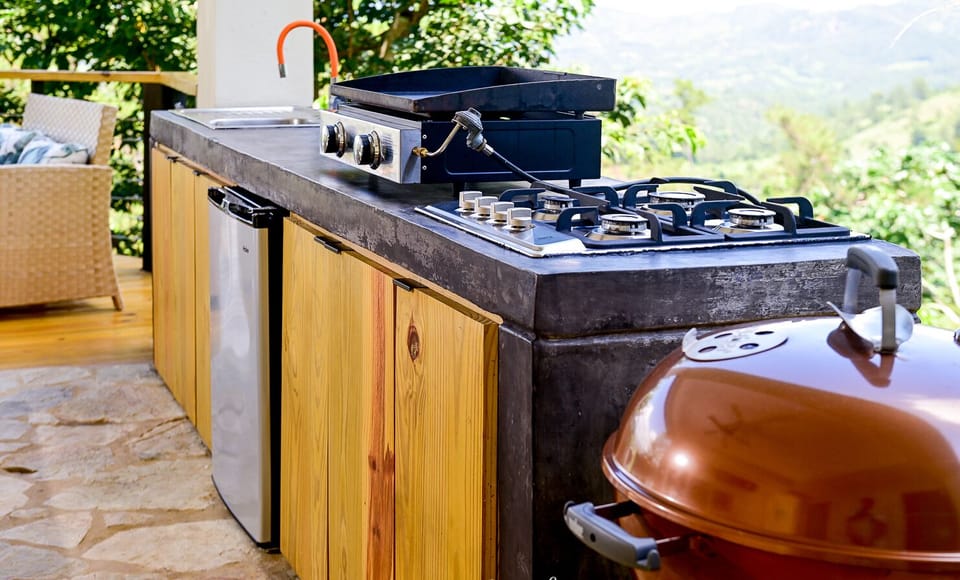 Outdoor kitchen- sink, Blackstone grill, charcoal grill, 2 burners, mini fridge 