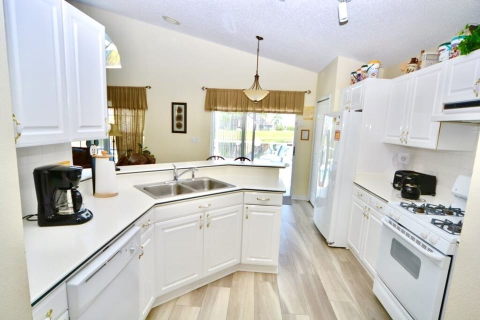 Fully equipped kitchen with access to the pool area