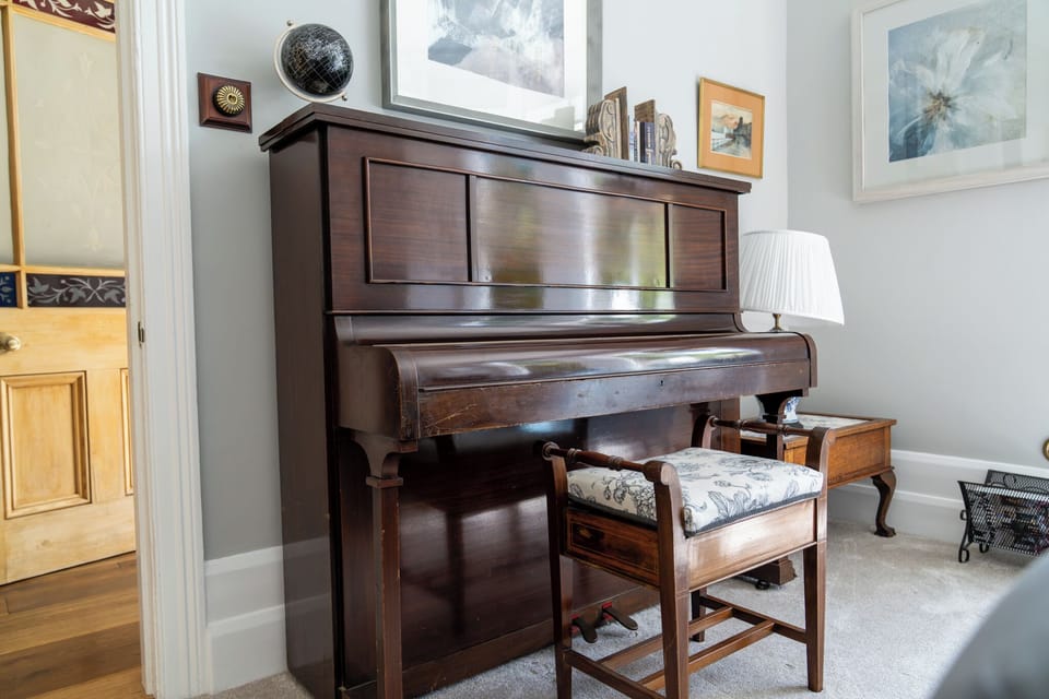 Tuned piano in one of the two living rooms.
