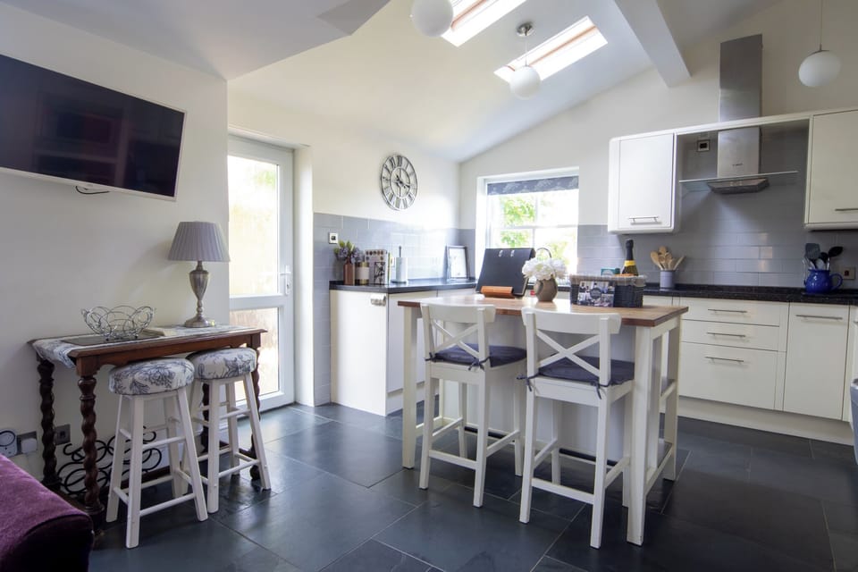 Light and airy well equipped kitchen overlooking the pretty garden.