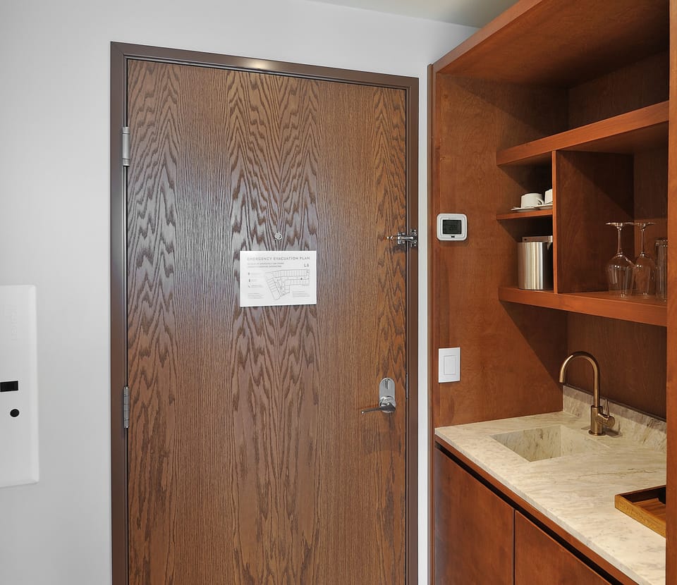 Prep easy snacks in the sleek kitchenette with bar sink.