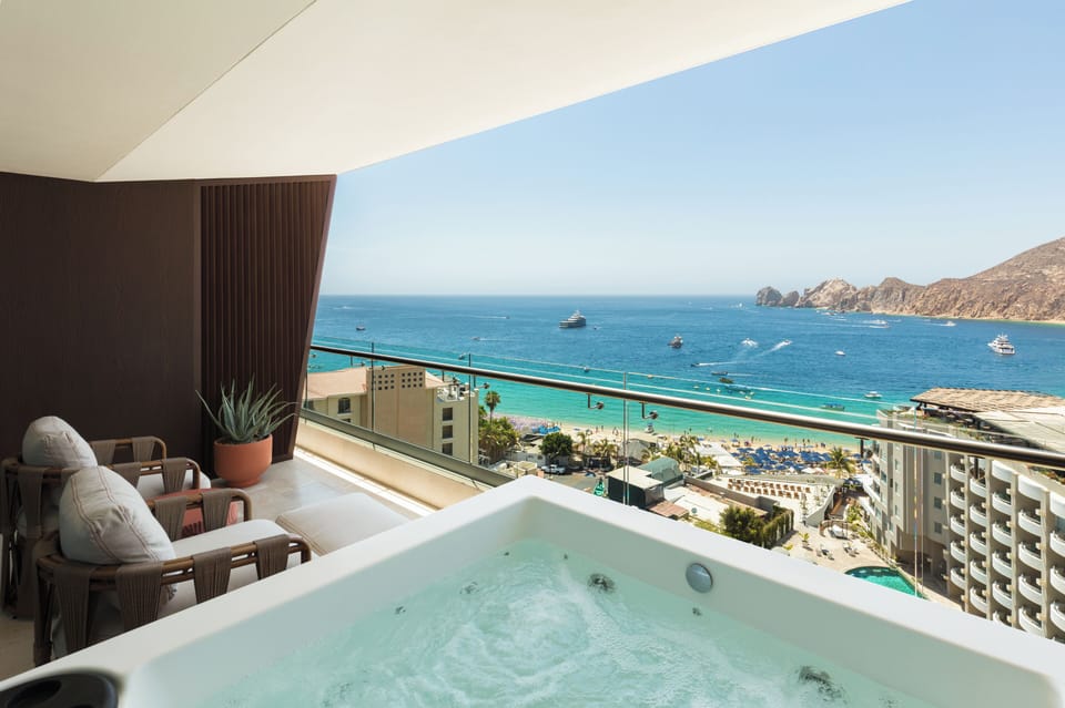 Soak in your private hot tub with endless ocean views.