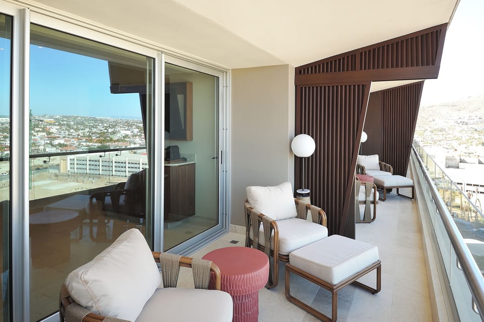 Linger over morning coffee in cushioned balcony loungers.
