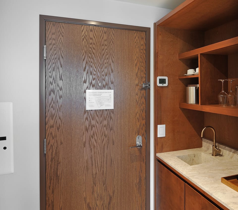 Prep easy snacks in the sleek kitchenette with bar sink.