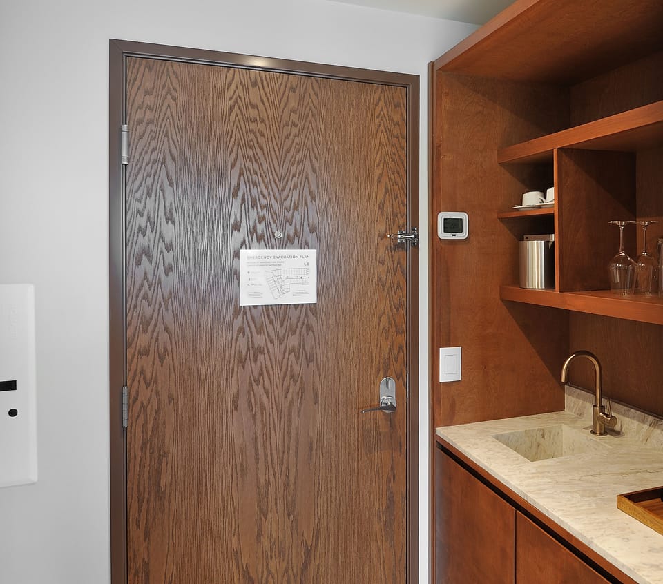 Prep easy snacks in the sleek kitchenette with bar sink.