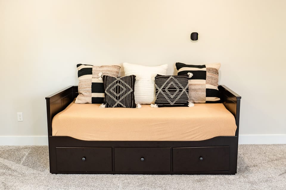 The daybed in the upstairs family room converts to a king bed or adjacent twins