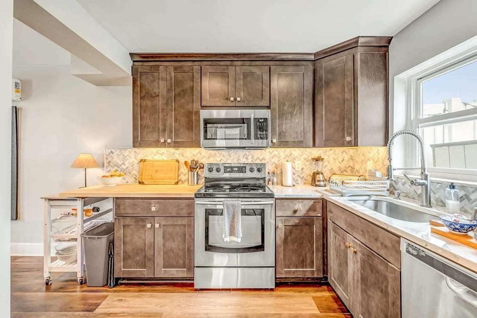 Kitchen fully equipped with utensils, pots and pans, glasses, flatware, and more to feel right at home when preparing your delicious meals