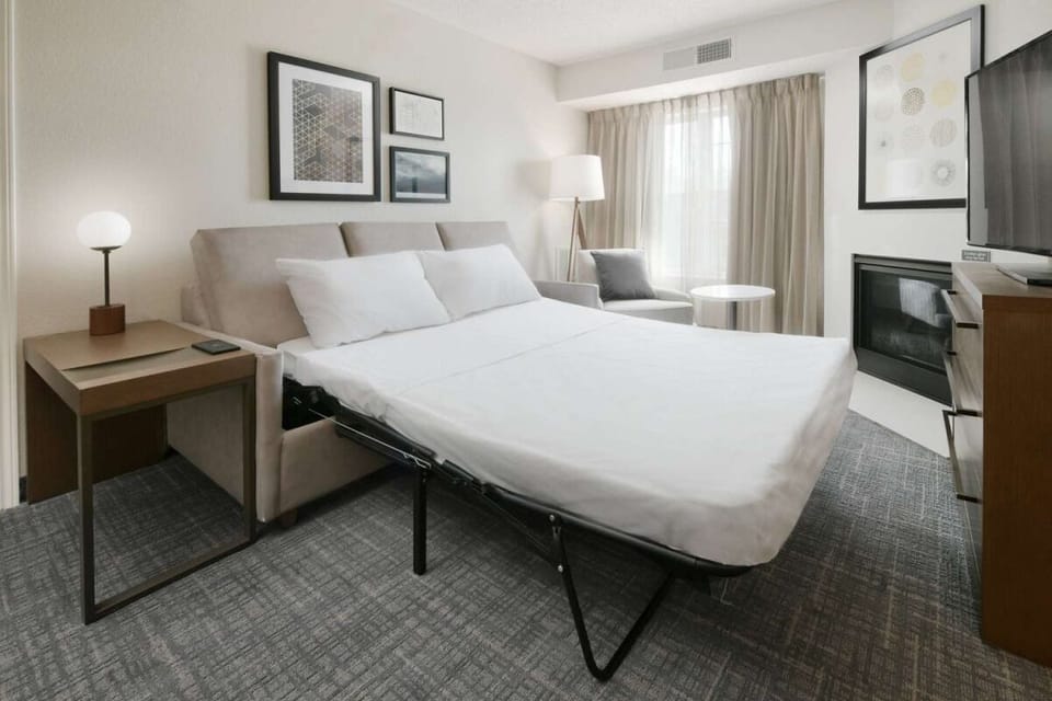 Stretch out and recharge in a bright room with seating.
