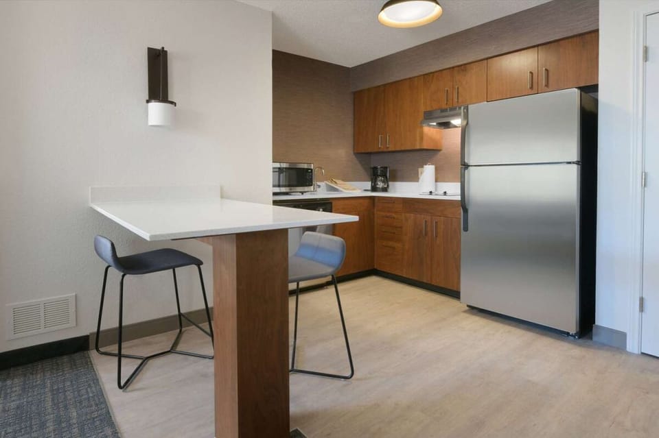 Cook and snack easily in the full kitchenette with bar seating.