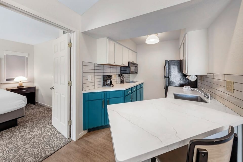 Cook easy meals in the sleek kitchenette with roomy counters.