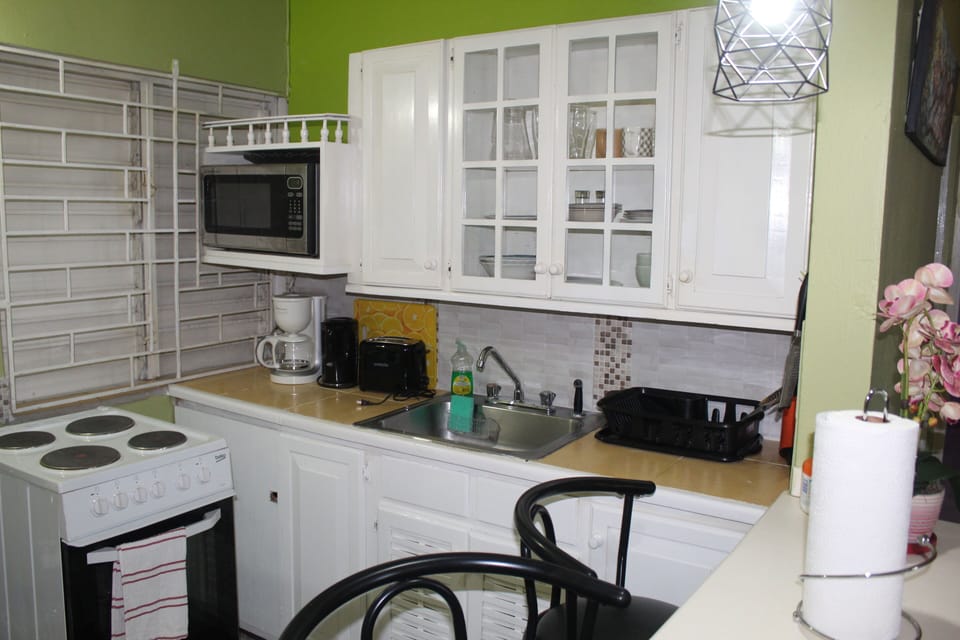 Fully-equipped kitchen with microwave, coffee maker, toaster and more