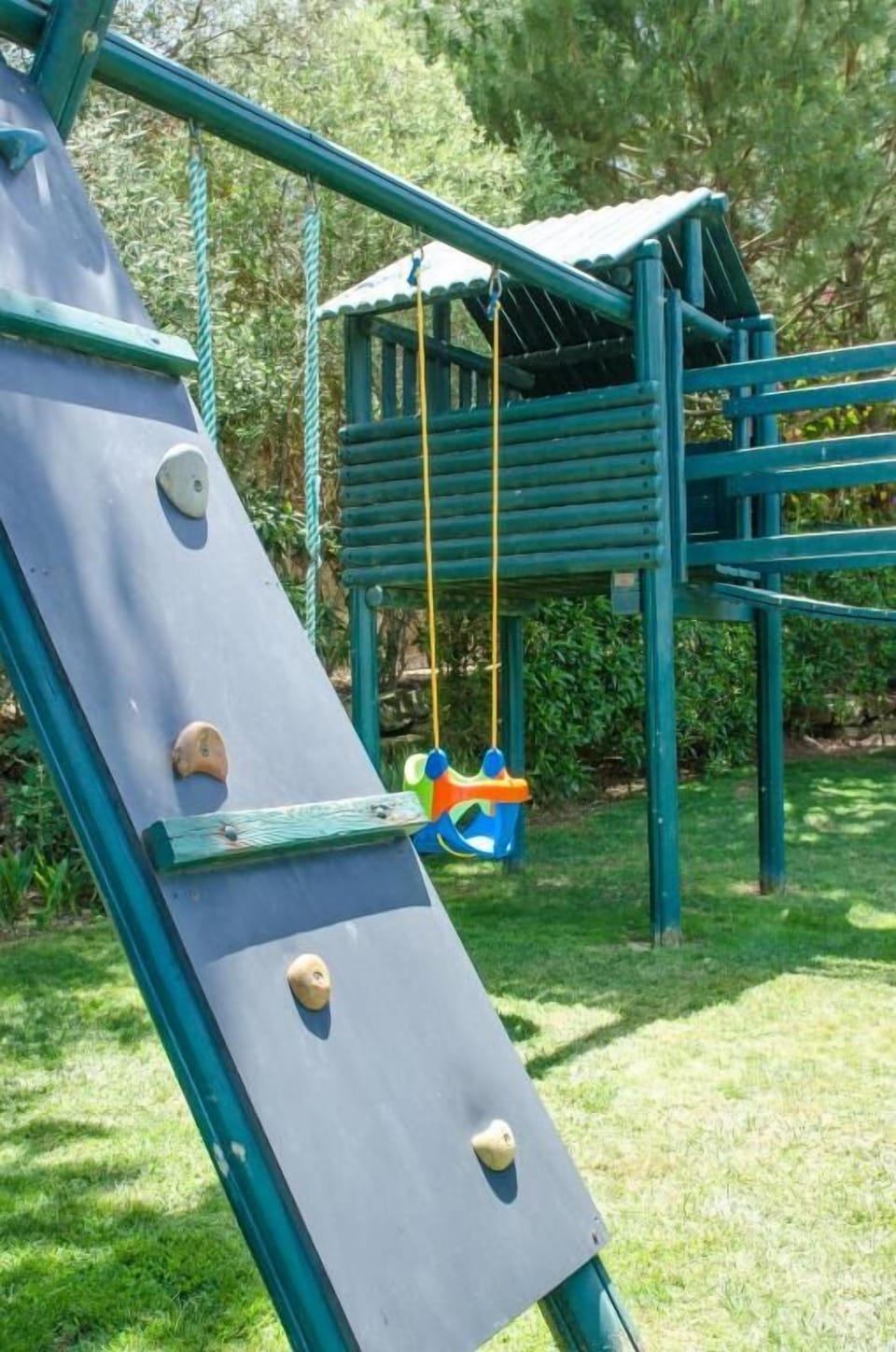 Watch little ones swing and explore in shaded play zones.