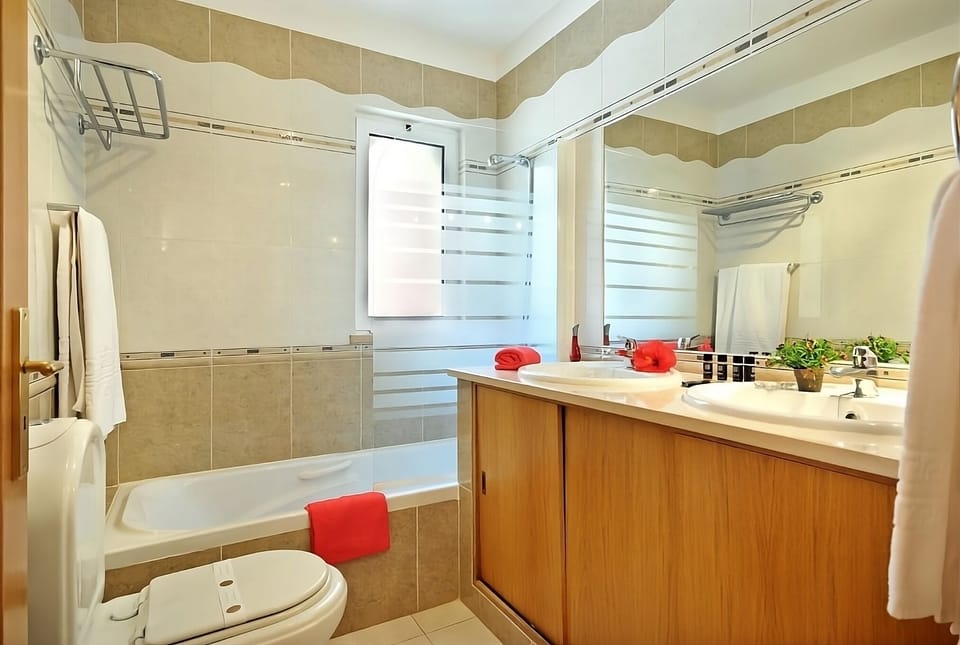 Refresh after adventures with a bright bath and double vanity.