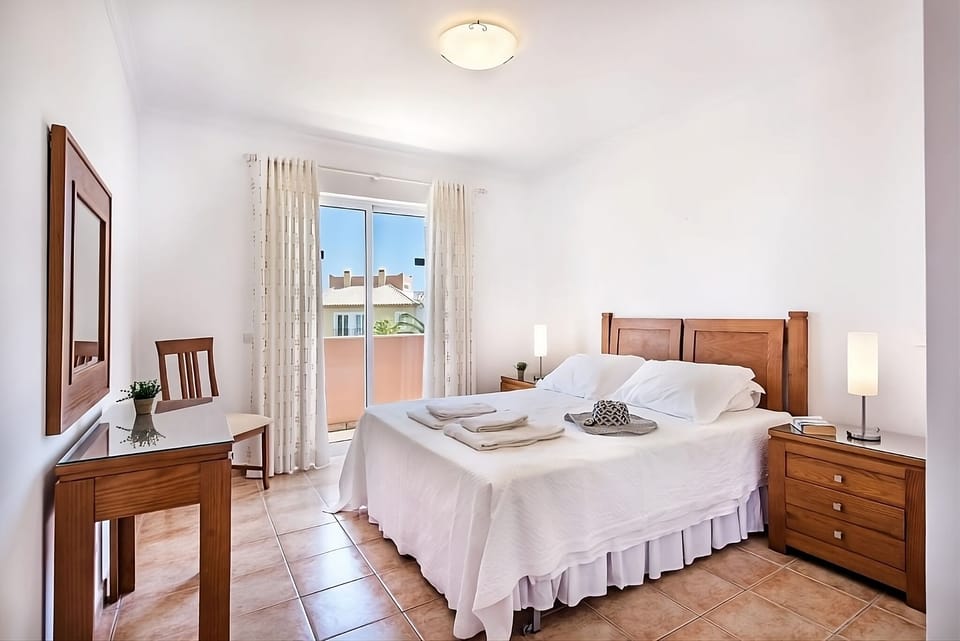 Stretch out in a serene bedroom with calm, airy light.