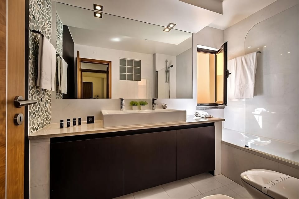 Refresh in a sunlit, spa-like bath with sleek finishes.