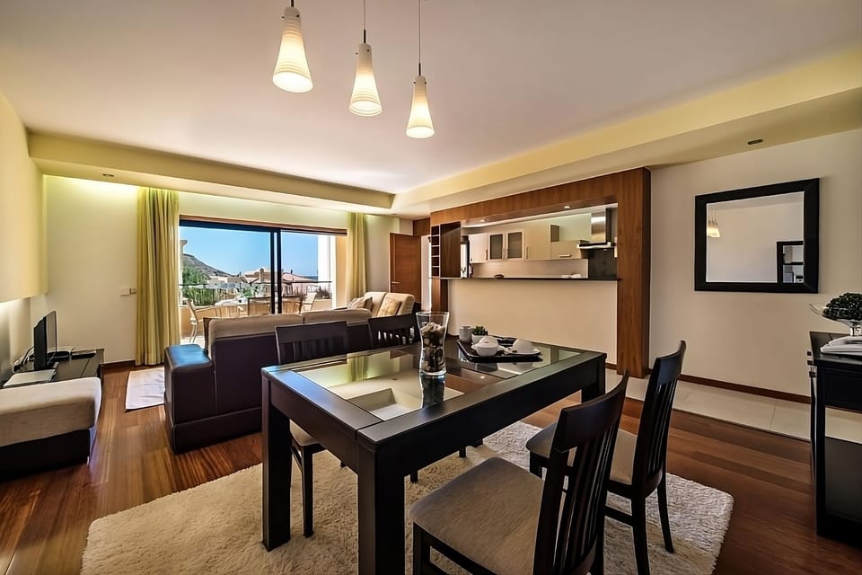 Host relaxed dinners around the table with kitchen close by.