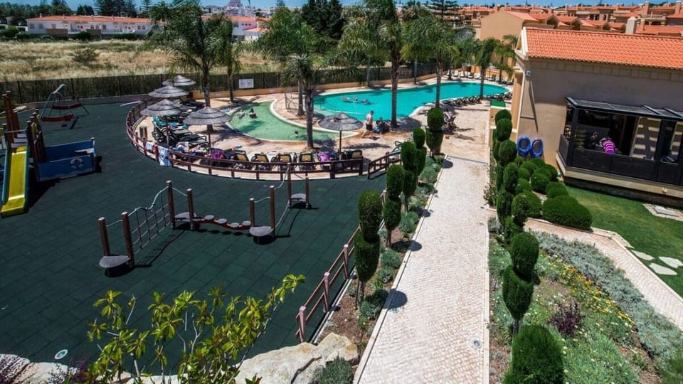 Let kids play freely while you relax by the pool.