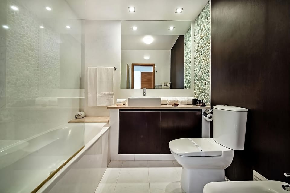 Refresh with a deep soak and sleek vanity under bright lights.