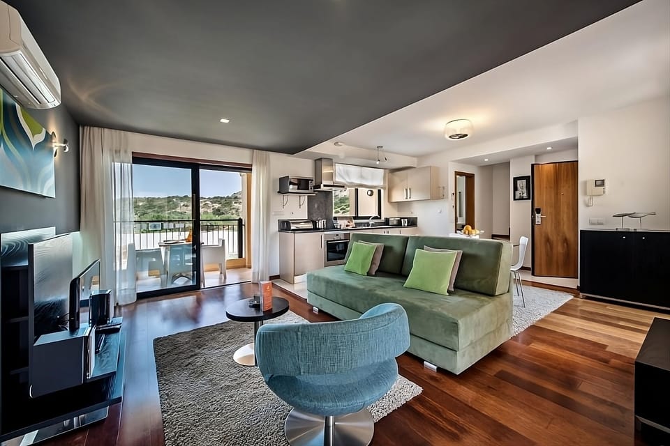 Stretch out in the airy open-plan lounge with balcony views.