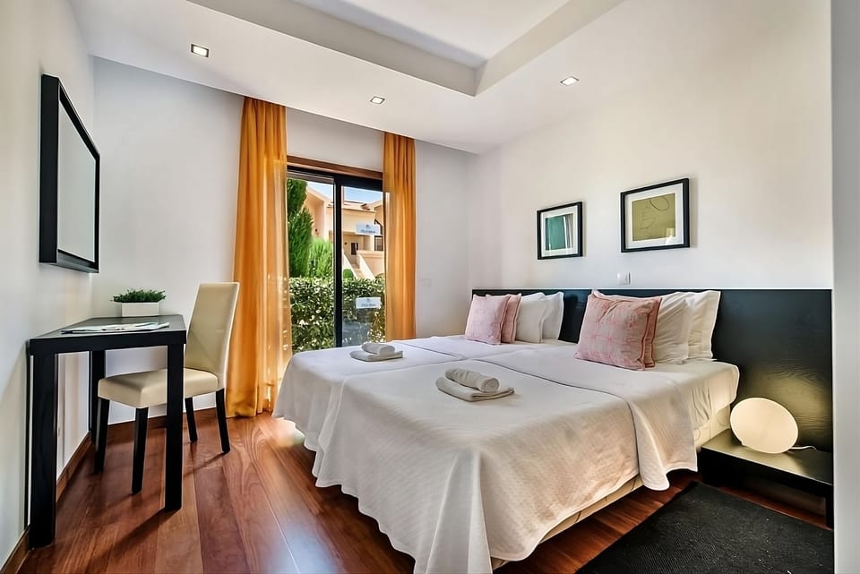 Stretch out on twin beds after a day of coastal exploring.