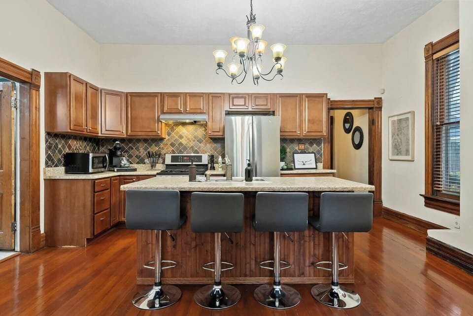 Four bar seats for dining seating at the kitchen island. 