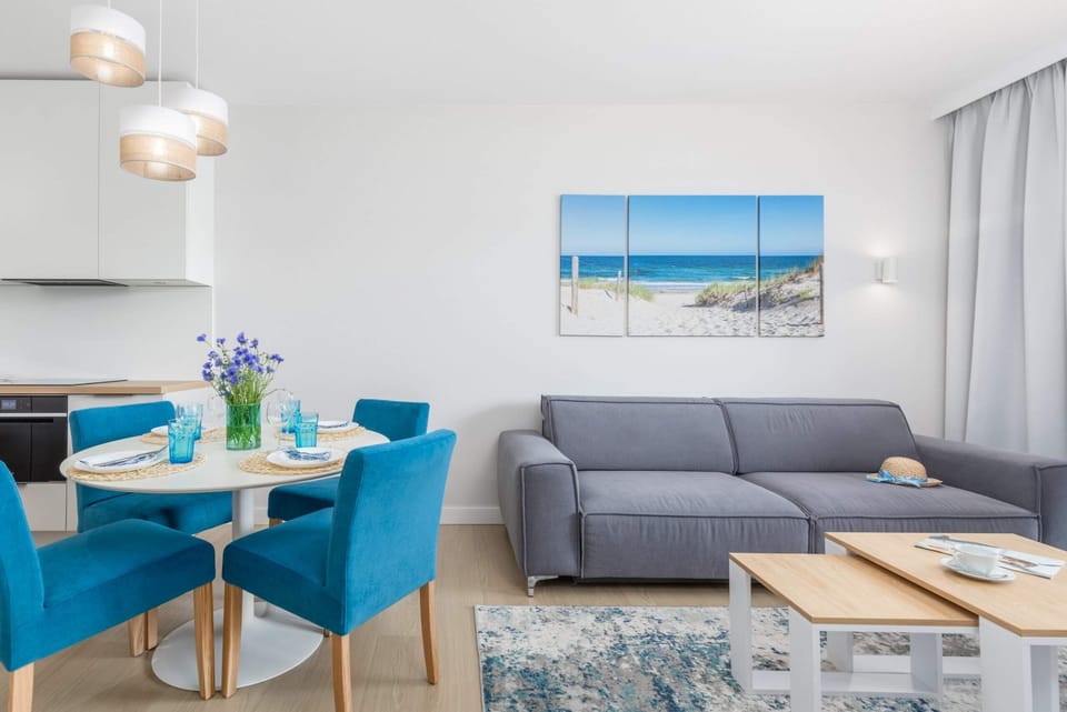 A different perspective of the dining and living area, highlighting decorative touches and ample natural light.
