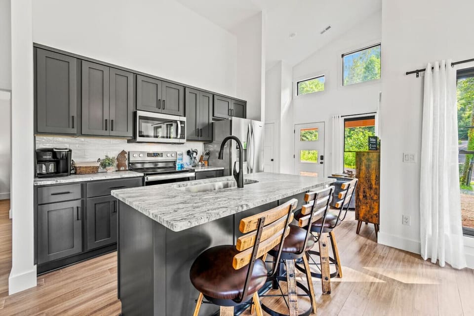 The kitchen includes a full suite of appliances as well as utensils, pots/pans, silverware, dishes, and more.