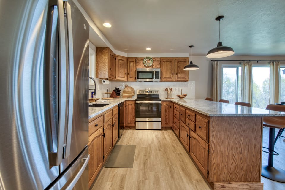 Beautiful kitchen with warm wood cabinets and granite countertops