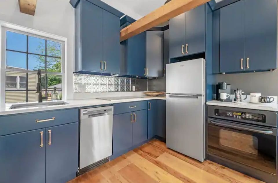 A colorful kitchen fully equipped with everything you'll need for cooking