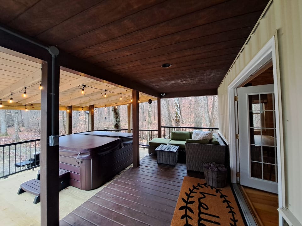 This hot tub and seating area are sure to be great gathering places!