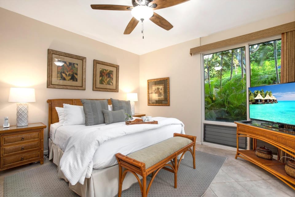 A serene sanctuary with warm woods, soft linens, and a tray of treats that says, “stay in bed a little longer.”   