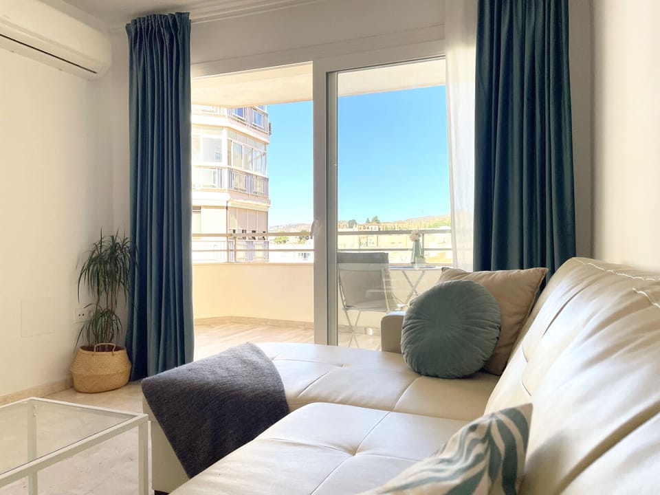 Cozy and luminous lounge with sofa, air conditioning and access to comfortable and wide terrace