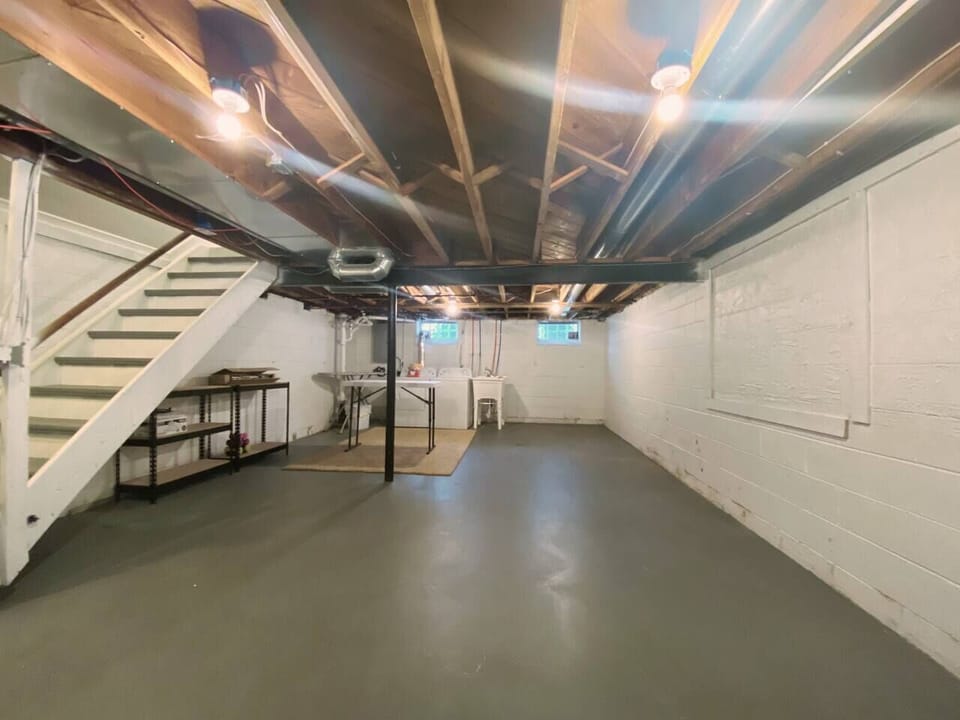 Huge basement with full washer and dryer and table to iron and fold.