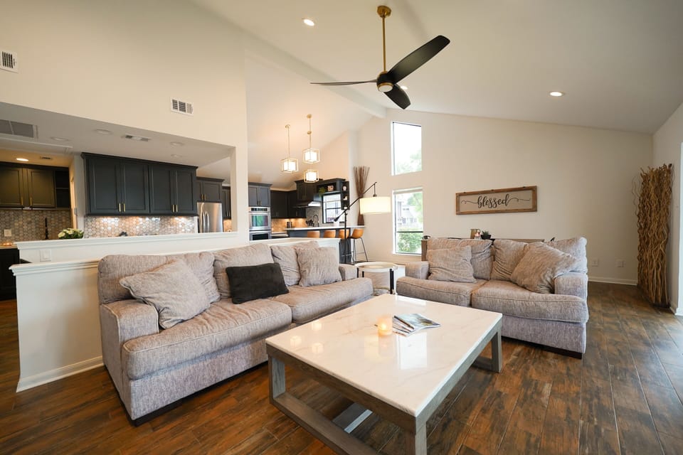 Living room looking into kitchen and dining area.