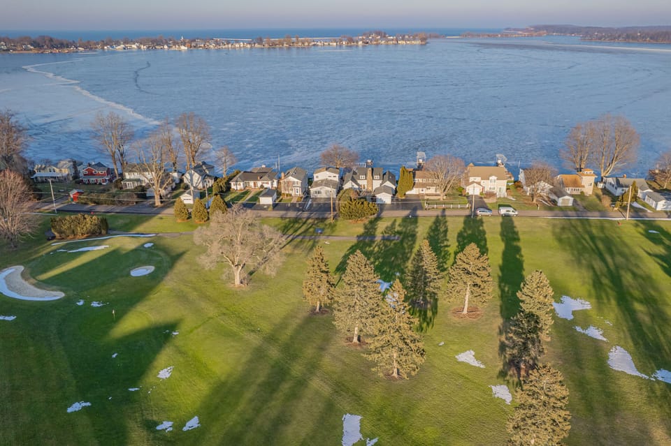 Aerial shot of golf course and house