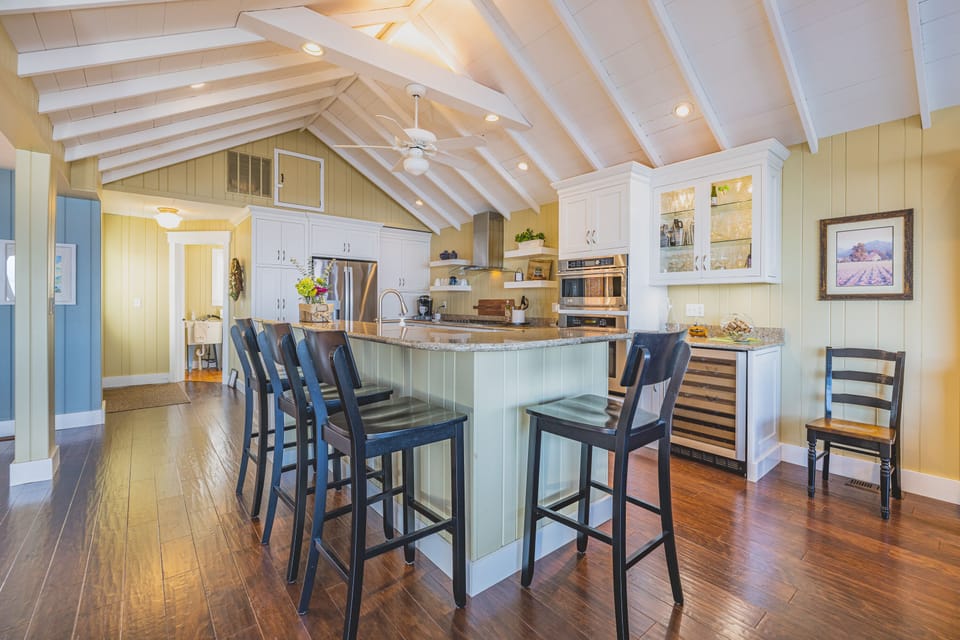 Great kitchen gathering spot complete with wine fridge