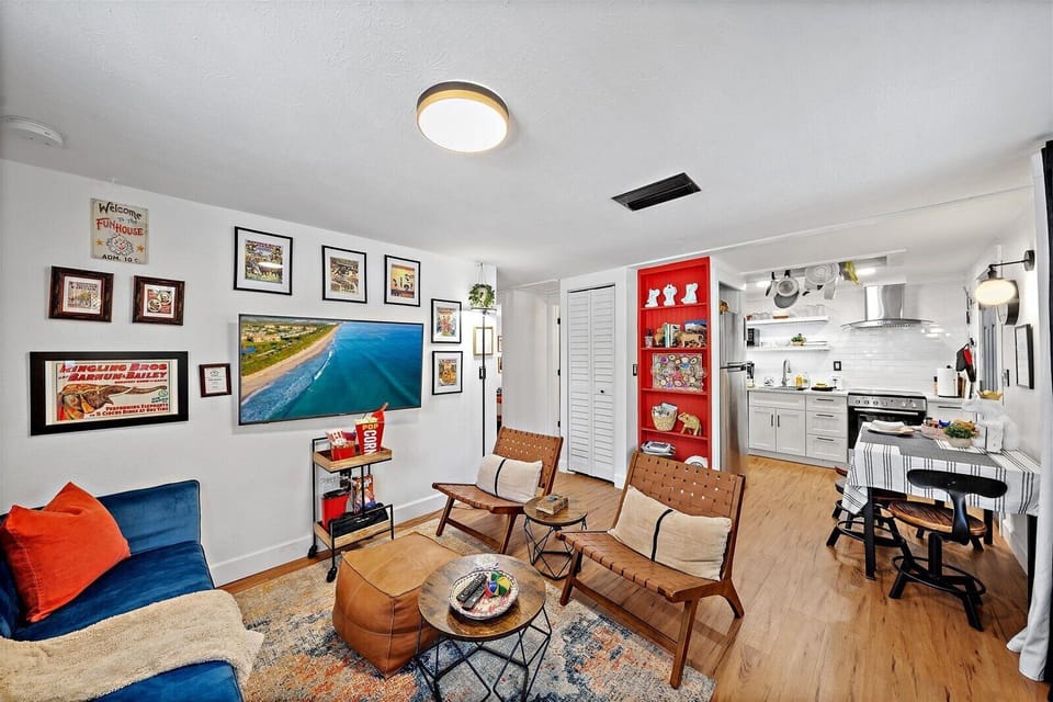The open-plan living room, dining, and kitchen create an inviting flow perfect for socializing.