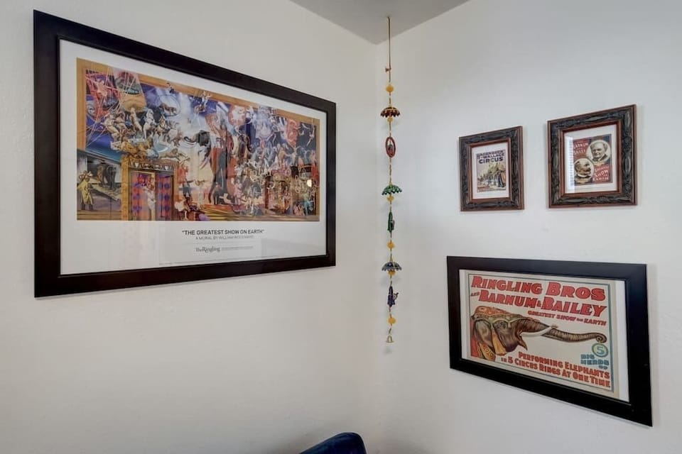 Step back in time with colorful retro prints adorning the walls, celebrating Sarasota's circus era.