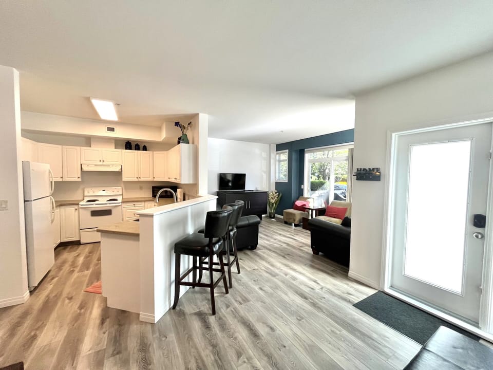 Here is a look into the kitchen space. Completed with bar stool seating