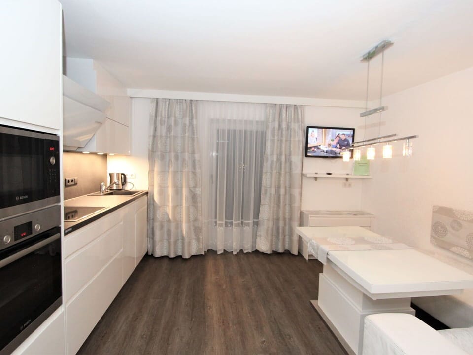Property, Cabinetry, Lighting, Interior Design, Wood, Flooring, Countertop, Floor, Building, Wall