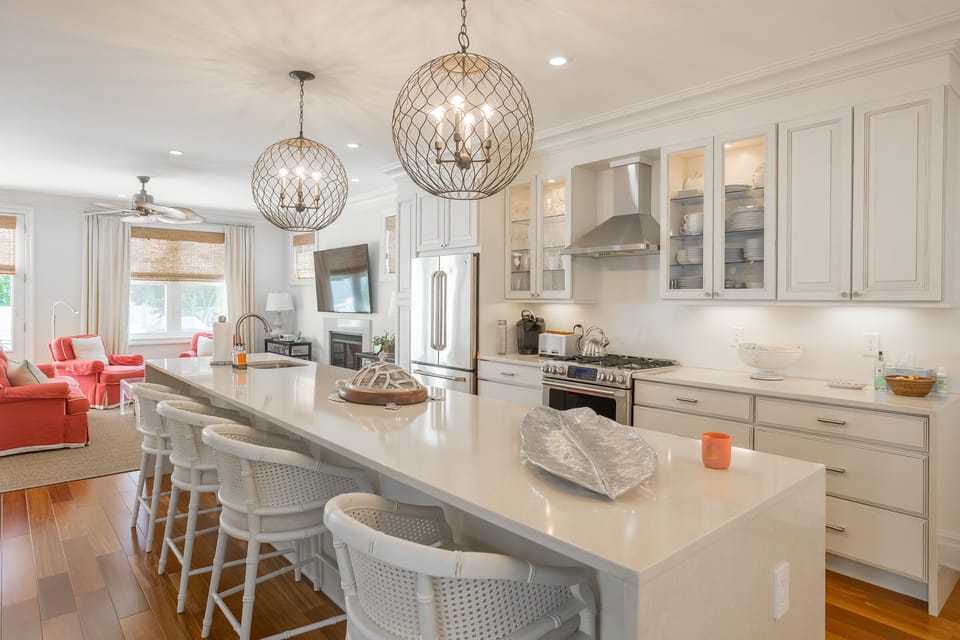 Beautiful Gourmet kitchen that is well stocked and ready to prepare meals at home! The island seats 4