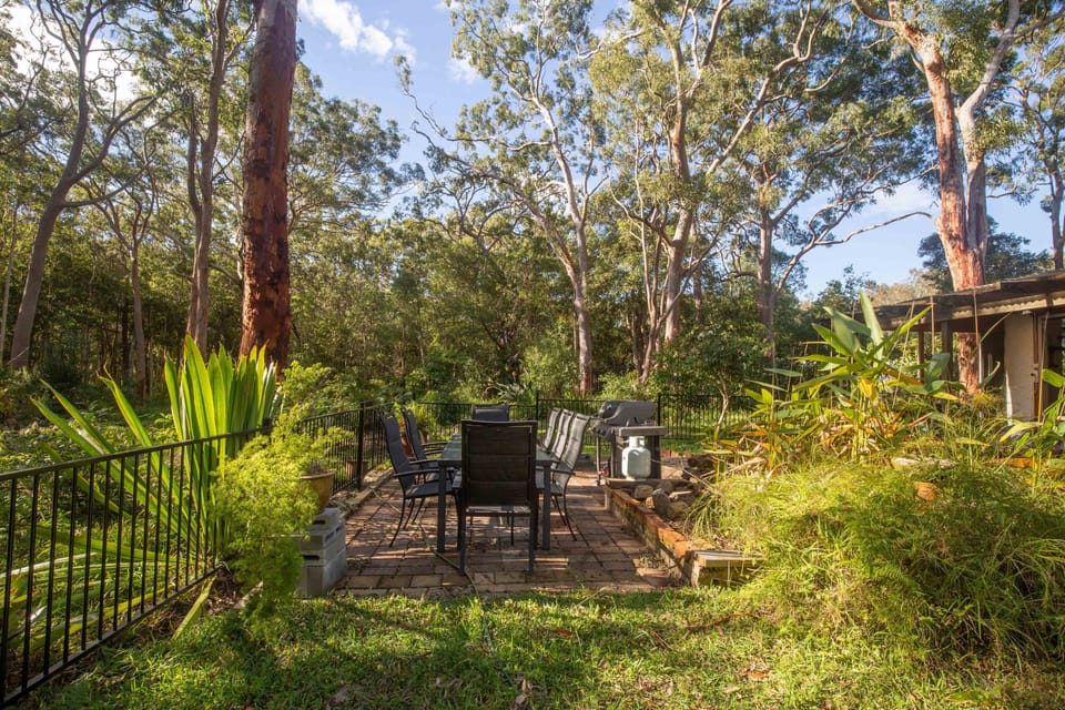 The outdoor area has a Weber gas BBQ and table for 8.
